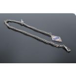 Silver Albert chain together with an enamelled fob. 31.2 grams. 50cm long.