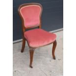 Edwardian upholstered parlour chair with pink upholstery. 90cm tall.