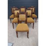 A set of 6 Victorian upholstered mahogany dining chairs with carved decoration (6). 98cm tall. In