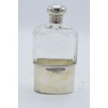 An Edwardian silver and glass hipflask with screw top lid. Hallmarked for London 1902. Hallmarks