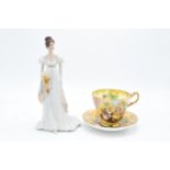 A Baron China cup and saucer in the Atchin Tan design depiciting Romany scenes together with a