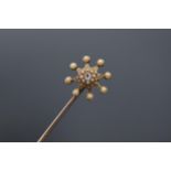 Tested as 15 carat gold pearl and diamond star hat pin on a base metal pin. 13.5 cm tall.