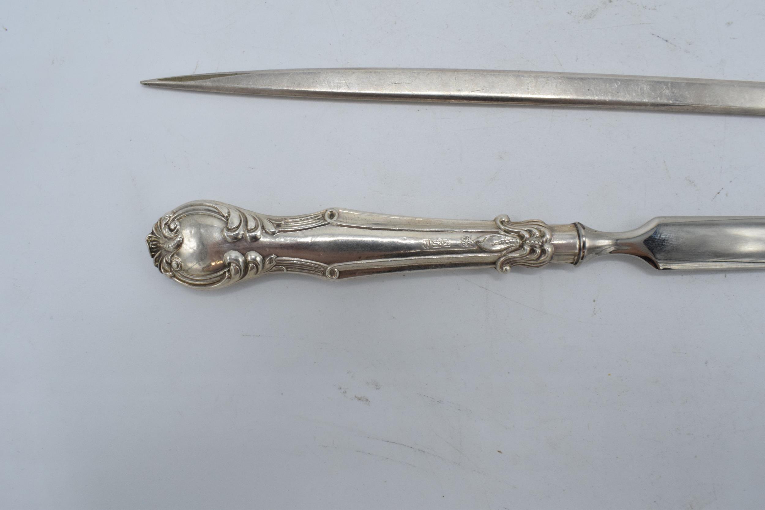 A silver handled letter opener together with a silver plated meat skewer (2). - Image 2 of 3