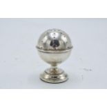 A silver ball shaped stick / hat pin holder. Birmingham 1920. 7cm tall.