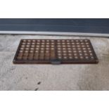 An early 20th century wooden printers letter block tray / rack with brass tacts. 83 x 39cm. (1269).