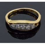 18ct gold ring set with 5 diamonds. UK size K/L. 2.7 grams. In good condition.