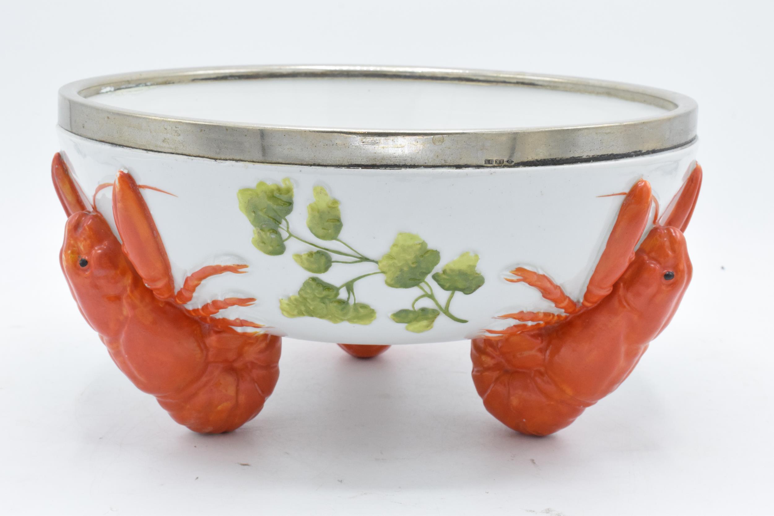 A 20th century Musterschutz bowl set on three feet in the form of lobsters with an EPNS rim. 26cm