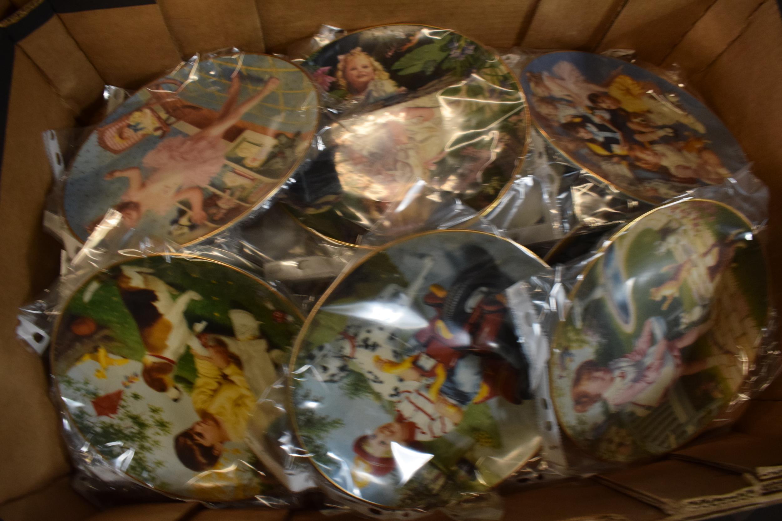 A large collection of Franklin mint and similar wall plates with designs such as children scenes,