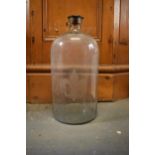 A large shop display glass jar with Fleur de Lys etched onto the front. In good condition. 53cm