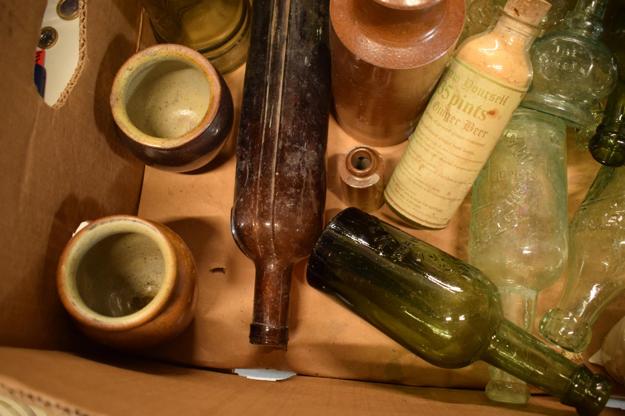 A mixed collection of vintage items to include stoneware jars and advertising glass bottles to - Image 3 of 5