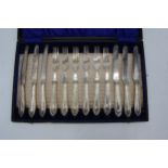 A cased set of silver plated cutlery to include 6 knifes and 6 forks.