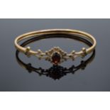 9ct gold and Garnet bangle 6.1g