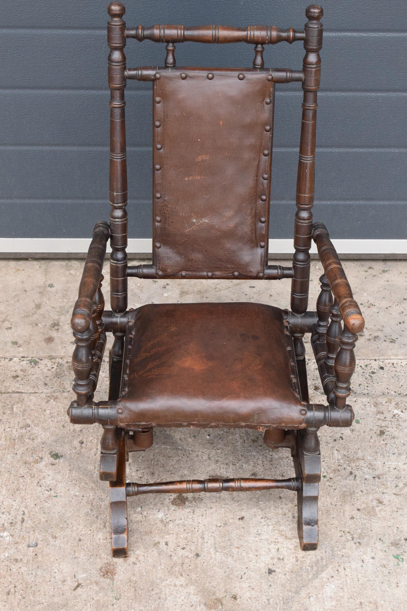 An early 20th century wooden childs American-style bobbin rocking armchair. 72cm tall. In good - Image 2 of 7