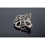 A silver brooch by Ola Gorie Orkney 1991 'Finnish Beast'.