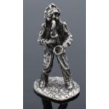 A silver model of a male saxophonist. With London import silver marks for late 20th century. 37.4