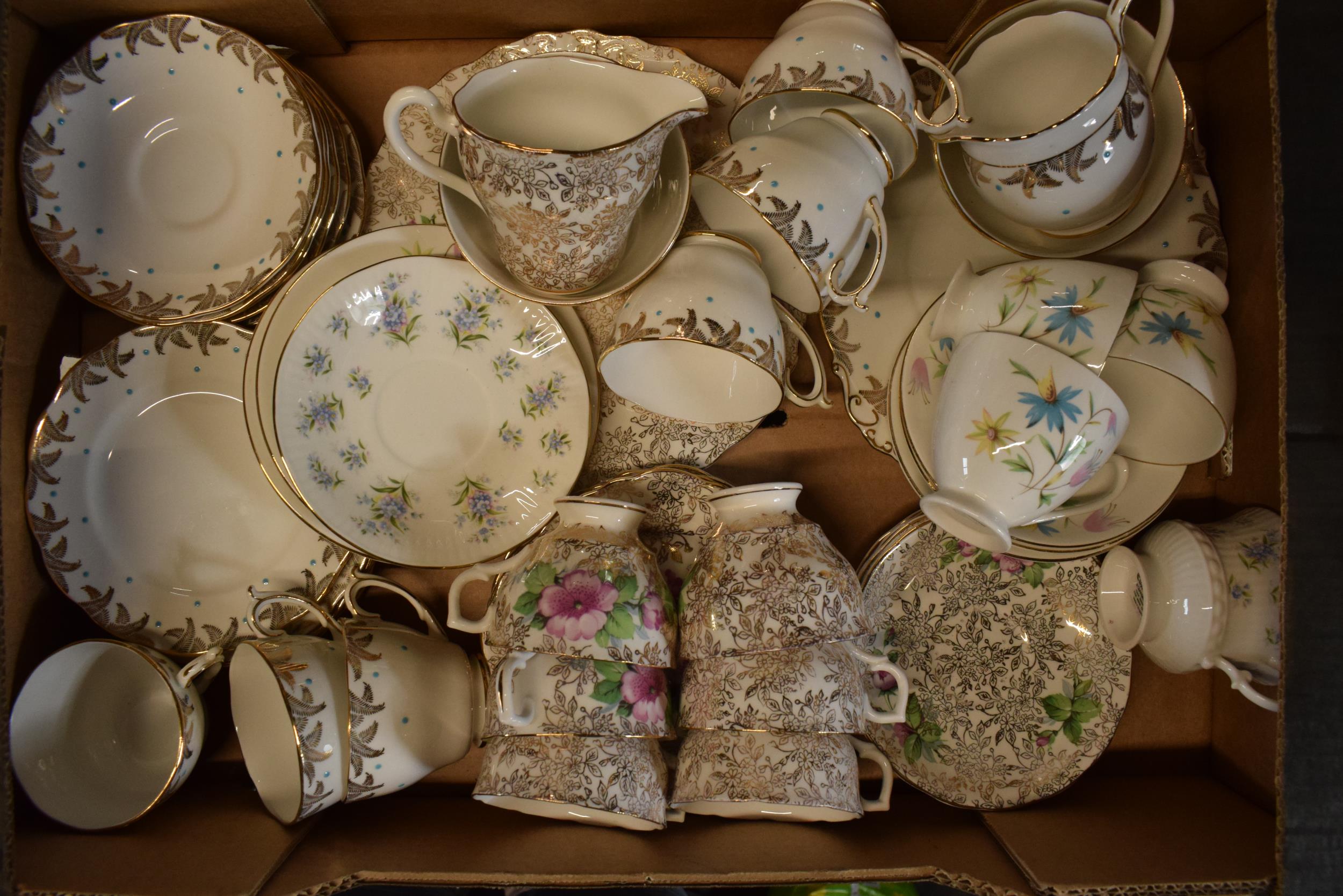 A collection of items to include 2 tea sets to include trios, milk and sugars, cake plates plus