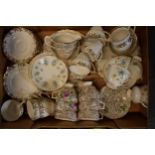 A collection of items to include 2 tea sets to include trios, milk and sugars, cake plates plus