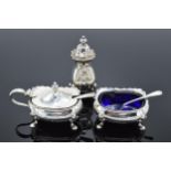 A collection of silver items to include a cruet, mustard pot, salt pot and 2 silver spoons (5).