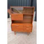 A good mid century teak or similar wood cabinet / sideboard with glass sliding doors and drawers