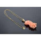 9ct gold and pink coral flower pendant on a 9ct gold chain. Gross weight 13.6 grams inc coral.