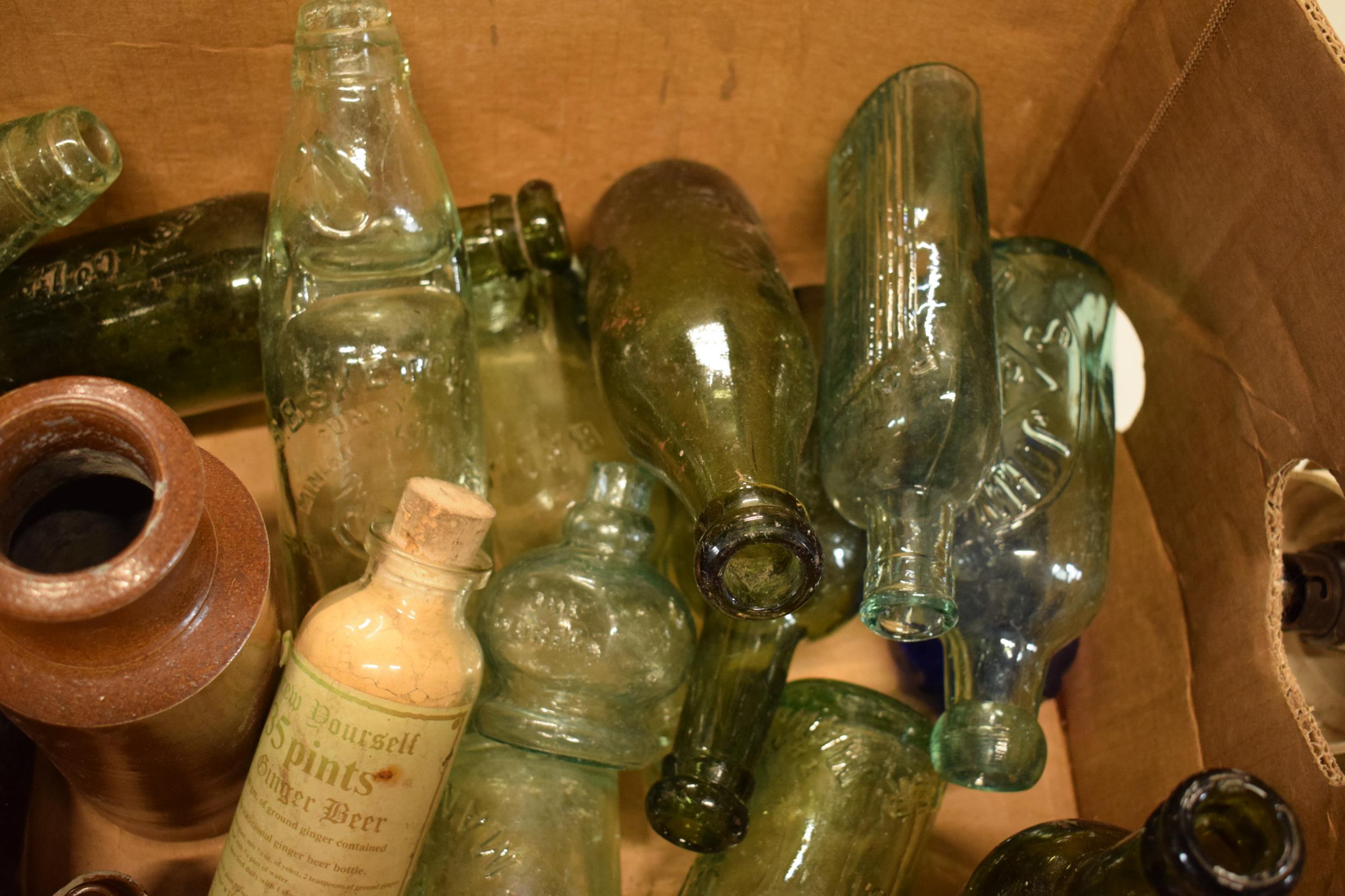 A mixed collection of vintage items to include stoneware jars and advertising glass bottles to - Image 5 of 5