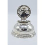 Large hallmarked silver inkwell with hinged lid. Birmingham 1927. 12cm widest diameter. No liner.