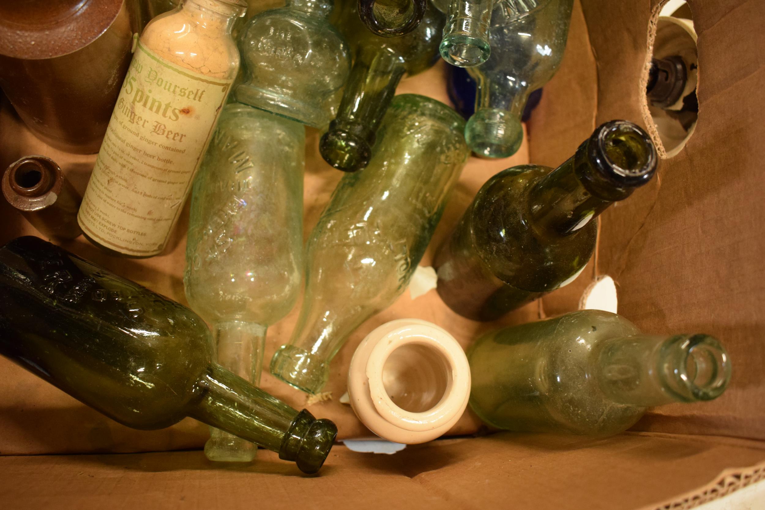 A mixed collection of vintage items to include stoneware jars and advertising glass bottles to - Image 4 of 5