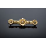 Tested as 9ct gold Edwardian bar brooch set with pearls. Gross weight 2.7 grams.