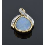 A 9ct gold pendant set with opal stone and illusion set diamonds. 1.0 grams.