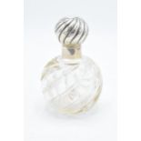 Silver topped scent bottle with swirling glass decoration 13cm tall. Hallmarked for London,