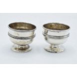 A pair of silver egg cups / table salts hallmarked for Chester 1902 (2). 54.8 grams. In good