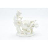 Moore Bros cherub dish with shaped edges and a floral design 15.5cm tall. 'MOORE' impressed to base.