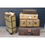 A good collection of vintage trunks and suit cases to include leather and similar examples.