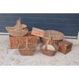 A collection of vintage wicker baskets and wooden boxes of various forms