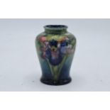 Moorcroft small bulbous vase in the Orchid (or similar) design. 9cm tall. In good condition with