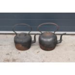 A pair of large 19th century cast metal tea pots (40cm tall) one lid missing finial. NO POSTAGE