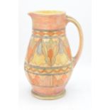 A Bursley Ware Charlotte Rhead tubelined jug with number to base. 25cm tall. In good condition