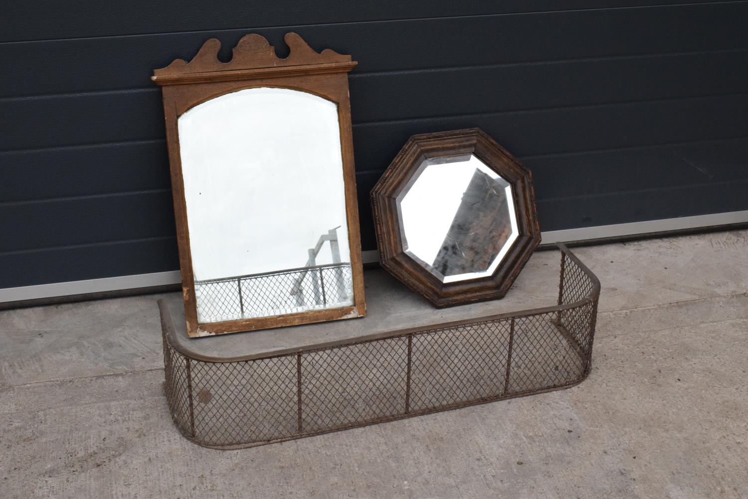 A collection of items to include a carved oak octagonal mirror, a rectangular mirror and a brass and