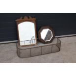 A collection of items to include a carved oak octagonal mirror, a rectangular mirror and a brass and