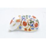 Boxed Royal Crown Derby paperweight in the form of a Sleeping Piglet. First quality with stopper. In