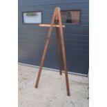 An early 20th century large wooden freestanding folding easel. In good functional condition. Some