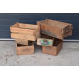 A collection of vintage wooden crates to include advertising examples for Rindless Cheddar Cheese,