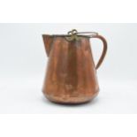 An unusual 19th century copper jug / pouring vessel with brass mounts. 24cm tall.