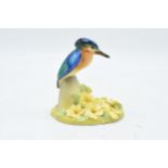 Royal Doulton figure depicting a kingfisher mounted onto a floral base. Circa 1920s. 12cm tall.