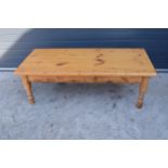 A 20th century solid low pine side table / coffee table. 152 x 70 x 51cm tall. In good functional