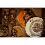 A collection of Empire Ware orange lustre tea set decorated with a floral design to include 6
