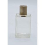 A silver topped French glass scent bottle. 9cm tall.