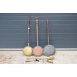 A collection of items to include a trio of brass and copper bed pans together with a part