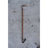 A late 19th / early 20th century riding crop with a silver collar together with an antler handle.