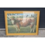 A framed jigsaw of a Longhorn cow in a wooden frame